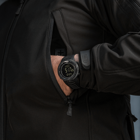 Person wearing M-Tac Tactical Watch 2147, rugged design with LED backlight, ideal for outdoor and everyday activity.