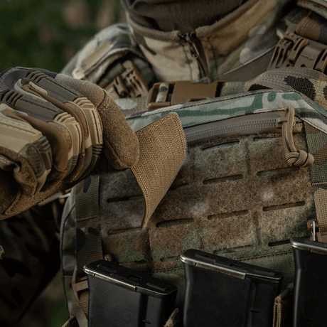 M-Tac Ukraine Flag patch with ZSU Trident PVC mounted on a military vest in woodland camouflage surroundings