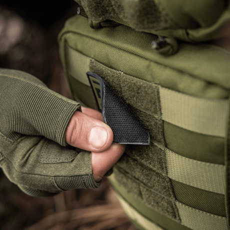 M-Tac Medic PVC 3D tactical patch attached to a military vest with Velcro, flexible PVC material, ideal for medical personnel.