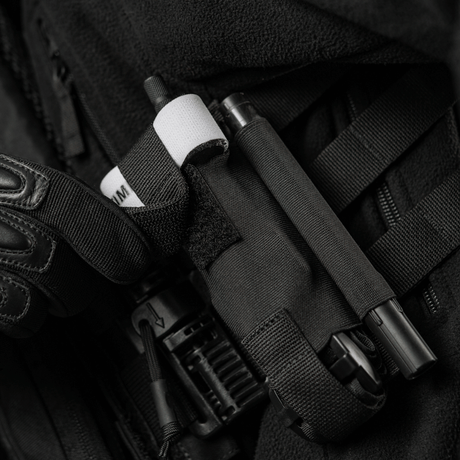 M-Tac Elastisk Tourniquet Pouch Molle Gen.III taske på en taktisk vest