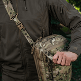 Person with M-Tac Tablet Bag Laser Cut Hex in camouflage design, featuring quick-access concealed weapon compartment