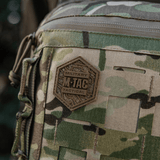 M-Tac Tablet Bag Laser Cut Hex in camouflage Cordura with hexagon patch and MOLLE system for tactical gear.