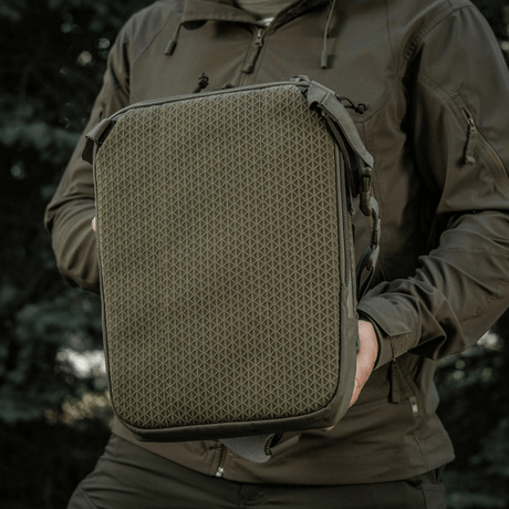 M-Tac Tablet Bag Laser Cut Hex in Cordura with Laser Cut MOLLE, shown in outdoor setting.