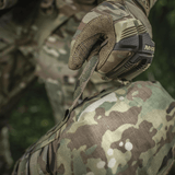 Soldier using M-Tac Sukharka Gen.3 Pouch with camouflage, Cordura 500D for military gear, field storage, and MOLLE attachment.