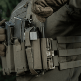 Soldier wearing M‑Tac Tourniquet Pouch Elastic Gen.5 with tactical gear in outdoor setting