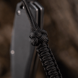 M-Tac Knife Lanyard Celtic, en flettet paracord lanyard i sort, der fremhæver knivens design og praktiske funktionalitet.