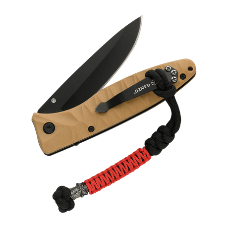 M-Tac Ninja Ver.2 Lanyard med paracord 550 og ninja-motiv fastgjort til en kniv. Stilfuldt tilbehør til løfteknive, lygter og små genstande.