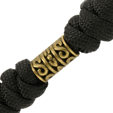 Nærbillede af M-Tac Zeus Lanyard med flettet paracord og stilfuldt design, ideel til kniv og udstyr.