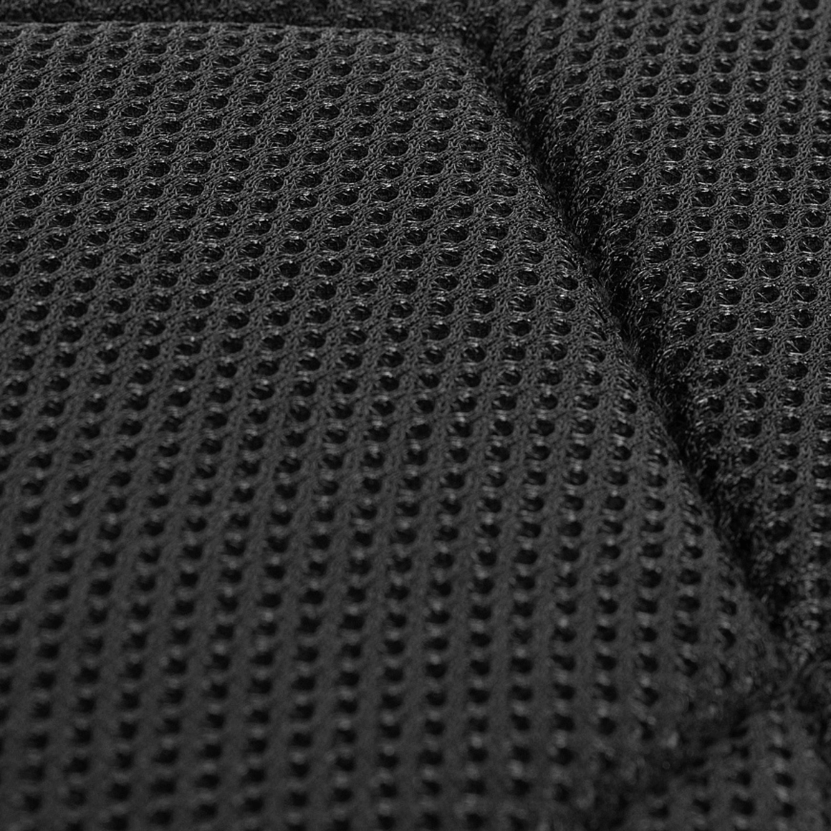 Nærbillede af mesh-materiale for ventilation på M-Tac Assault Pack Laser Cut rygsæk