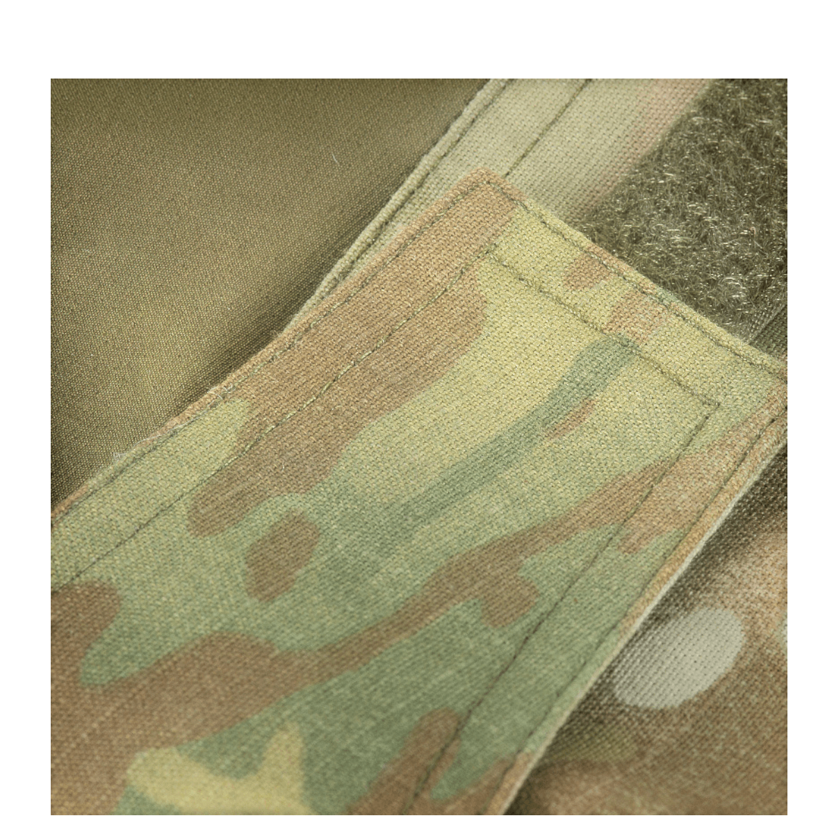 Detalje af M-Tac Bukser Army Gen. II NYCO Extreme med camouflage mønster og velcro lukning, fremstillet af robust NYCO Extreme stof.