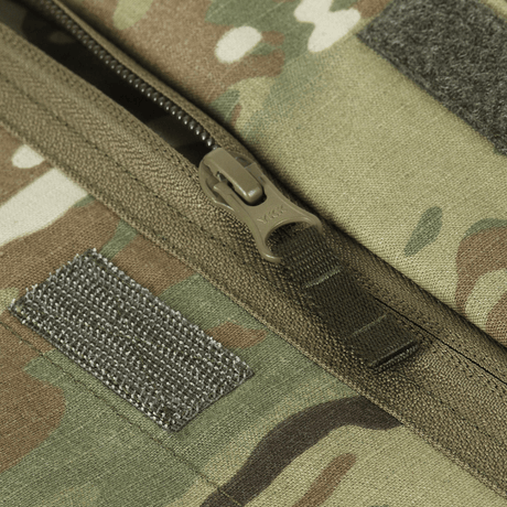 Close-up of M-Tac Jakke Sturm NYCO Extreme with YKK zipper in Multicam pattern, showing durable fabric and quality stitching details.