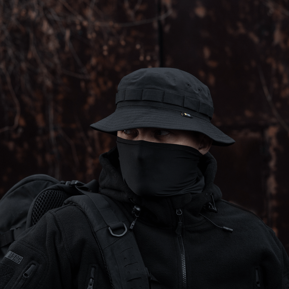 Person wearing M-Tac Panama Rip-Stop army hat with camouflage features and breathable design, perfect for outdoors in windy conditions.