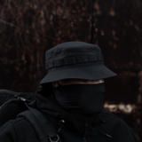 Person wearing M-Tac Panama Rip-Stop hat with semi-stiv skygge in outdoor setting