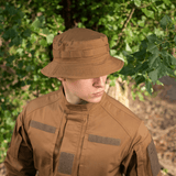 Person wearing M-Tac Panama Rip-Stop hat with camouflage gear