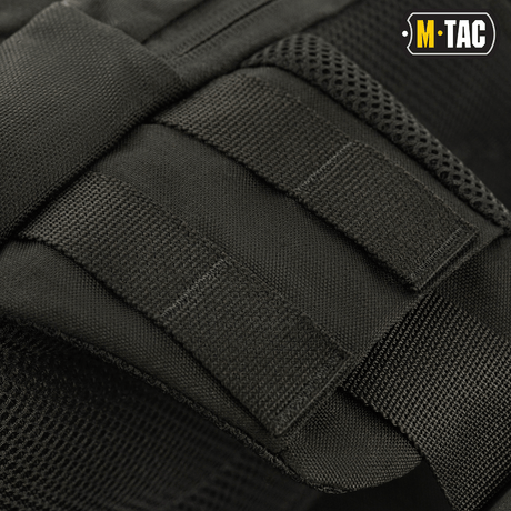 Nærbillede af M-Tac Buckler Taske Elite med MOLLE-system til ekstraudstyr, designet i sort Cordura 500D materiale.