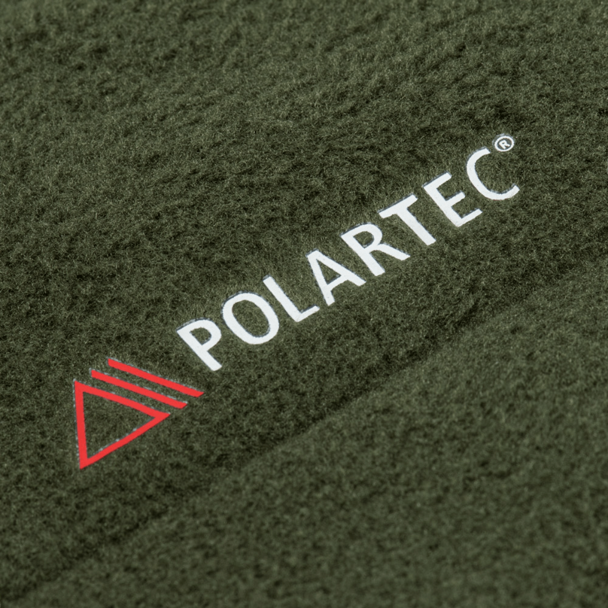 M-Tac Combat Fleece Polartec Jakke stofdetalje med Polartec® logo i nærbillede.