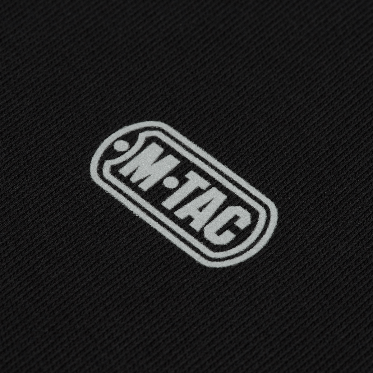 Logo på M-Tac Cotton Raglan Hard Hoodie i 100% bomuld med stilfuldt design og fleecefor for komfort og varme.