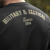 M-Tac T-Shirt Logo med "Military & Tactical Since 2014" camouflage print på ryggen, symboliserer brandets taktiske arv.