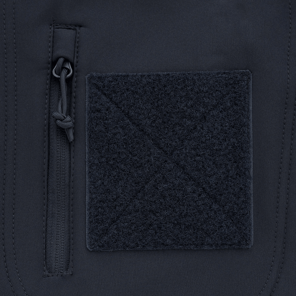 Detalje af M-Tac Soft Shell Jakke med Liner, viser lynlås og fleecepanel.