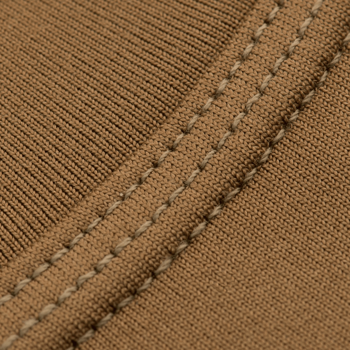 Detalje af M-Tac ThermoLine Termoundertøj syning med antibakteriel behandling, designet til optimal komfort og termoregulering.