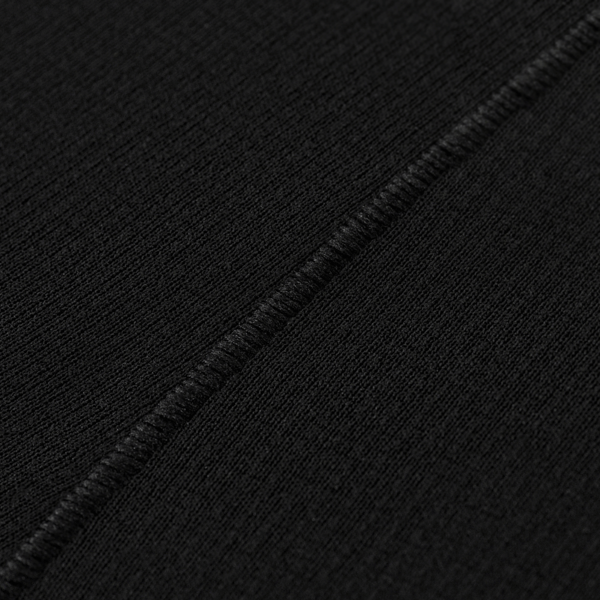 Sort fleece detalje på M-Tac Vinter Termobukser 3/4 Baselayer med flade sømme, fremstillet af Pontetorto® materiale.