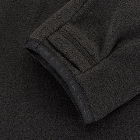 M-Tac Delta Polartec Raglan Jakke detaljer, tæt på Micro Series fleece materiale, fokus på ærmedesign og holdbarhed.