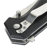 Nærbillede af håndtaget på M-Tac Outdoor & Militær foldekniv - Type 5 med G10-komposit greb og aluminiumskonstruktion.